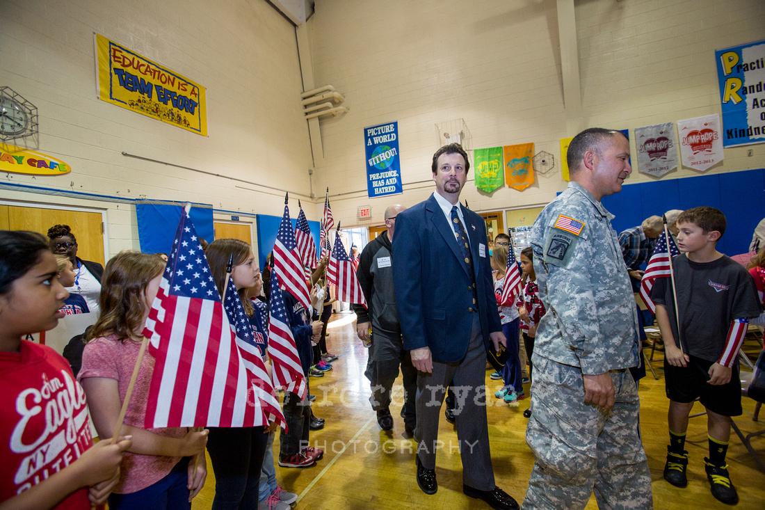 Robert Pecht Retired Navy, of Bordentown City, enters the MacFarland Intermediate School on Tuesday, November 11, 2014, Bordentown, NJ held it's Honor Veterans Ceremony and to never forget why the men and women in our country fight for us.
